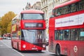 LONDON, UNITED KINGDOM - NOVEMBER 13, 2021: Famous double decker red buses on a street of London