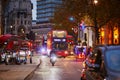 LONDON, UNITED KINGDOM - NOVEMBER 13, 2021: Famous double decker red buses on a street of London