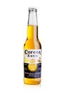 LONDON, UNITED KINGDOM - October 23, 2016: Bottle of Corona Extra Beer on white. Corona, produced by Grupo Modelo with Anheuser Bu Royalty Free Stock Photo