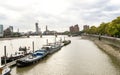 River Thames view from Albert bridge and boats parked near Battersea park embankment, London, England