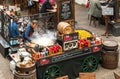 Young man cooking Paella in the outdoor bar of Covent Garden Apple Market in London. Royalty Free Stock Photo