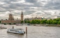 London - view of Big Ben clock tower, Houses of Parliament and Thames river with boats. Royalty Free Stock Photo