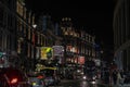 London West End at night with bright advertisement screens around theater buildings Royalty Free Stock Photo