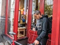 London woman with smart phone and bicycle