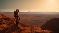 A lone astronaut standing on the surface of the red planet Mars. He looks around and observes the breathtaking view. Royalty Free Stock Photo