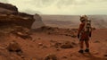 A lone astronaut standing on the surface of the red planet Mars. He looks around and observes the breathtaking view. Royalty Free Stock Photo