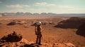 A lone astronaut standing on the surface of the red planet Mars. He looks around and observes the breathtaking view. Royalty Free Stock Photo