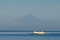 Lone Balinese Boat Against Mt. Agung Royalty Free Stock Photo