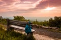 A lone bench faces the mountains under a stormy sunset at High Point State Park Royalty Free Stock Photo