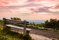 A lone bench faces the mountains under a stormy sunset at High Point State Park Royalty Free Stock Photo