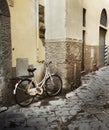 Lone bicycle leaning against a wall