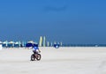 A lone bicyclist. Empty beach