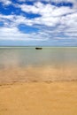 Lone boat on horizon