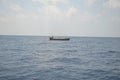 Lone boat on at the open sea