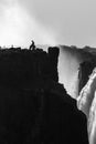 Lone border guard on the Zimbabwean side of the Victoria Falls in grayscale Royalty Free Stock Photo