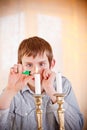 Lone boy lighting candles Royalty Free Stock Photo