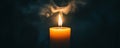 Lone candle burning against a dark background, atmospheric warmth and solitude concept Royalty Free Stock Photo