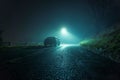 A lone car, parked on the side of the road, underneath a street light, on a spooky, scary, rural, country road. On a foggy winters