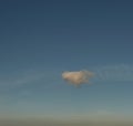 Lone cloud drifting across sky, panorama format