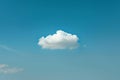 A lone cloud drifts peacefully through the vast blue sky, A single cloud floating in a clear, bright blue sky, AI Generated Royalty Free Stock Photo