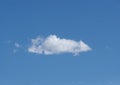 Lone cloud floating in deep blue sky panorama