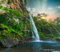 Lone creek waterfall and pond below during colorful sunset in Sabie Royalty Free Stock Photo