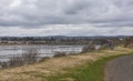 A Lone Cyclist taking a rest on a grassy bank on the Riverside Nature Trail overlooking Invergowrie Village.