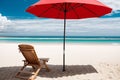 A lone deck chair under an umbrella overlooking a deserted beach Royalty Free Stock Photo