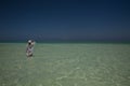 Lone figure on beach in Michamwi-Pingwe Zanzibar, Royalty Free Stock Photo