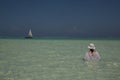 Lone figure on beach in Michamwi-Pingwe Zanzibar, Royalty Free Stock Photo