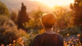 A lone figure gazes out at the breathtaking view of Mount Olympus Sanctuary with back to the camera. The soft colors of