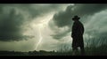 A lone figure stands in a field during a thunderstorm. Dark clouds hover ominously, and a lightning bolt strikes in the distance Royalty Free Stock Photo