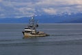 Fishing boat returns to the Harbor Royalty Free Stock Photo