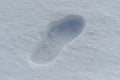 lone footprint or boot on the snow the next person