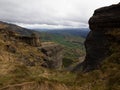 Lone hiker enjoying backcountry nature landscape mountain panorama at Bell Rock lookout in Tutira Hawkes Bay New Zealand