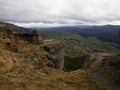 Lone hiker enjoying backcountry nature landscape mountain panorama at Bell Rock lookout in Tutira Hawkes Bay New Zealand