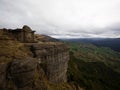 Lone hiker enjoying backcountry nature landscape mountain panorama at Bell Rock lookout in Tutira Hawkes Bay New Zealand