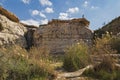 A Lone Hiker Taking Photos from the Cliffs above the Ein Akev Spring in the Israel Desert Royalty Free Stock Photo