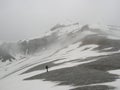 Lone hiker on a winter mountain