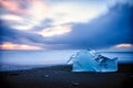 Lone iceberg melting by the ocean