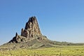 Lone Rock Jutting Out In Monument Valley