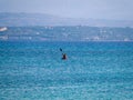 Lone kayaker in perfect blue sea