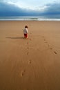 Lone kid on the beach Royalty Free Stock Photo