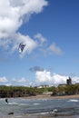 Lone kite surfer skimming the waves