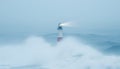 A lone lighthouse in the middle of a raging storm, surrounded by massive ocean waves and thick fog rolling in from the sea 2 Royalty Free Stock Photo