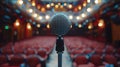 A lone microphone stands at the front of an empty auditorium, its sleek design and graceful lines Royalty Free Stock Photo