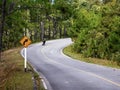 Lone motorcyclist on a country road Royalty Free Stock Photo