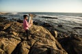 Lone musician play to Tuba on romantic sea shore. Royalty Free Stock Photo