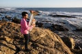 Lone musician playing the Tuba on the sea coast. Royalty Free Stock Photo