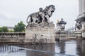 Lone Paris rental bicycle stands at the base of a statue on the Royalty Free Stock Photo